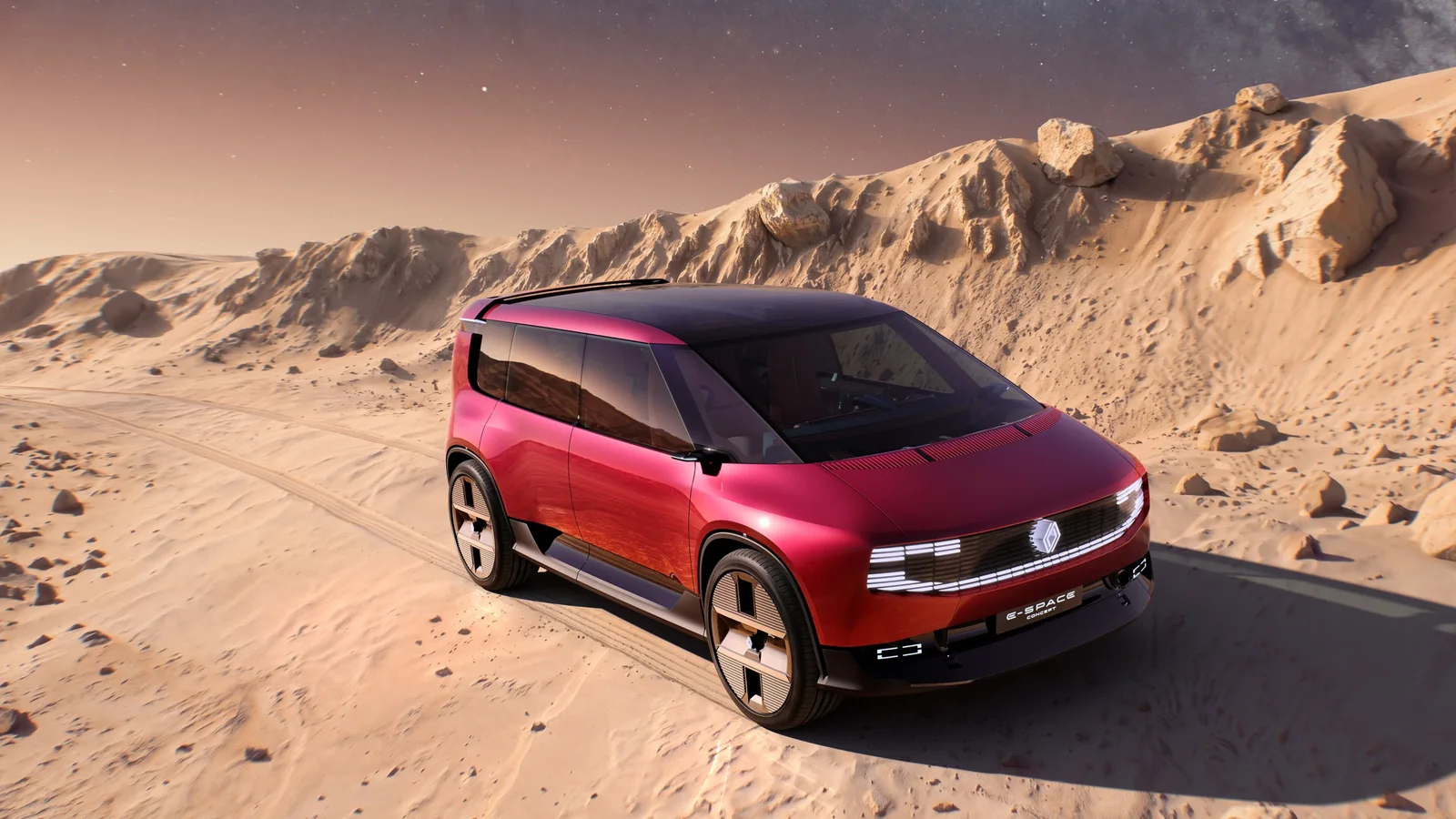 Renault E-Space Concept roșu, văzut din față și lateral, într-un peisaj deșertic.