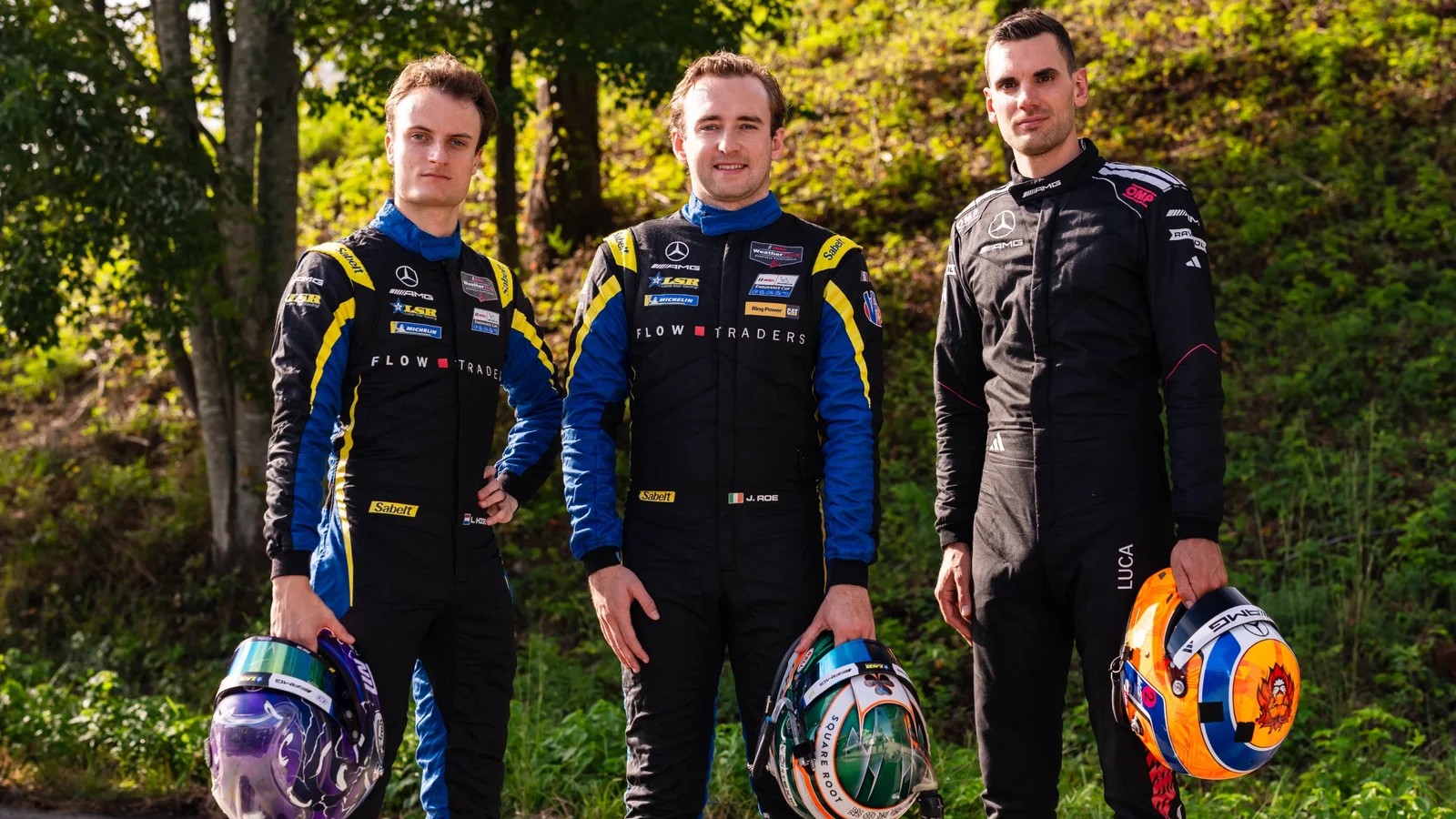 Piloții Philip Ellis, Russell Ward și Indy Dontje, echipați în combinezoane de curse, fotografiați înainte de Petit Le Mans.